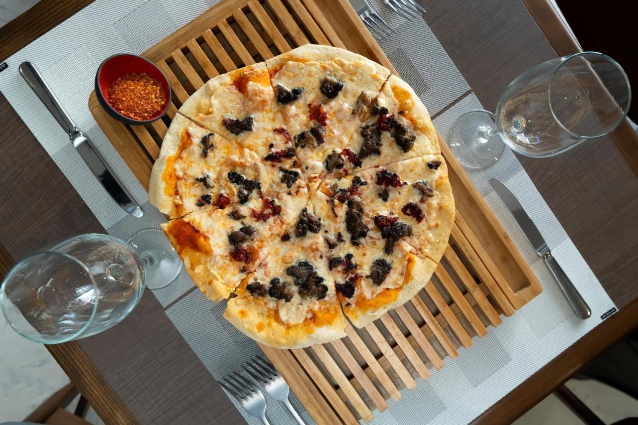 Metria Hotel Λεόν Εξωτερικό φωτογραφία A pizza